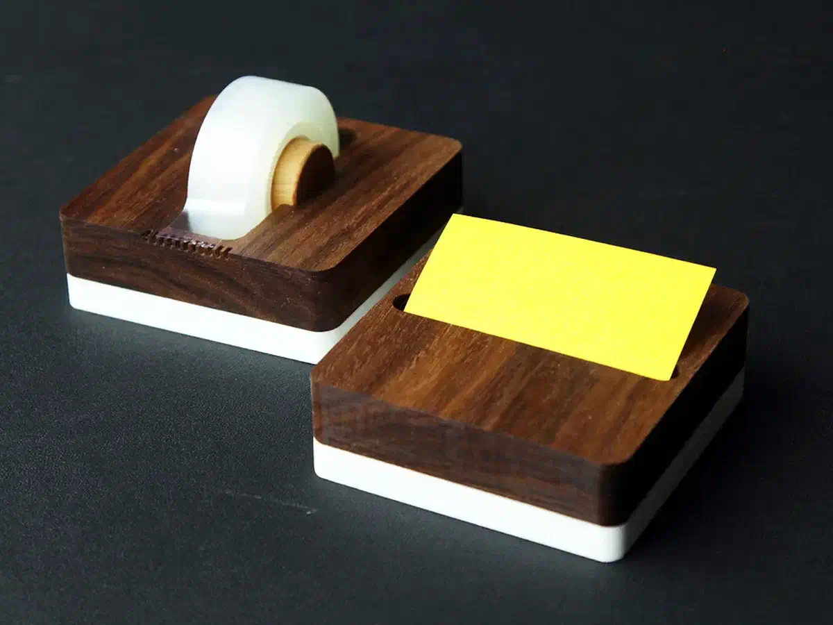 Finished walnut and white note holder with yellow notes beside a matching loaded tape dispenser