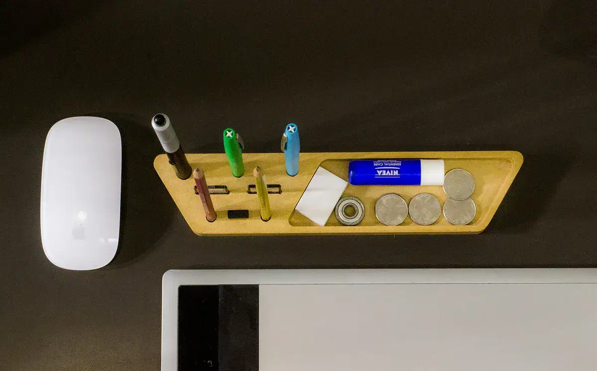 Finished yellow MDF organizer holding pens, markers, storage cards, and a USB device