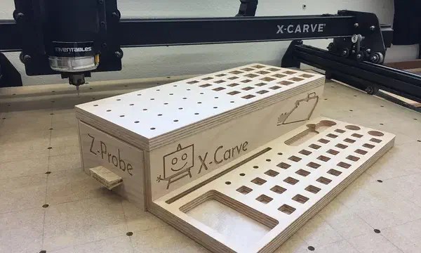 Two-tier plywood tool rack with rows of holes and rectangular clamp slots